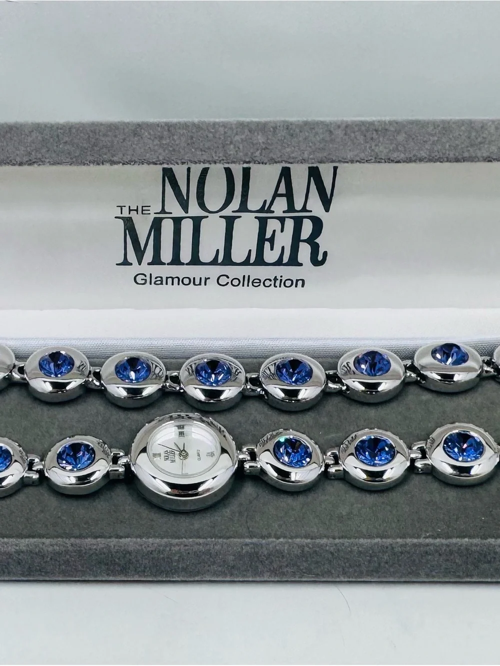 Nolan Miller Women's Silver Bracelet Watch with Matching Blue Crystal Bracelet